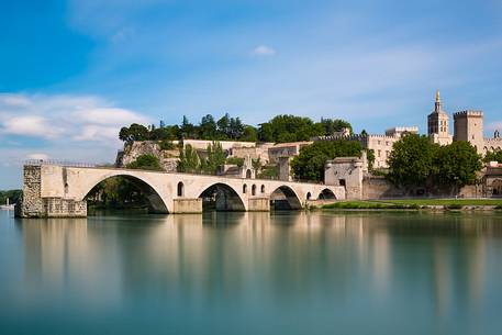 The city of Avignon across the Rhone River. The historic bridge of Avignon, Pont Saint-Benezet.