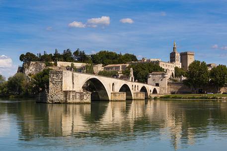 The city of Avignon across the Rhone River. The historic bridge of Avignon, Pont Saint-Benezet.