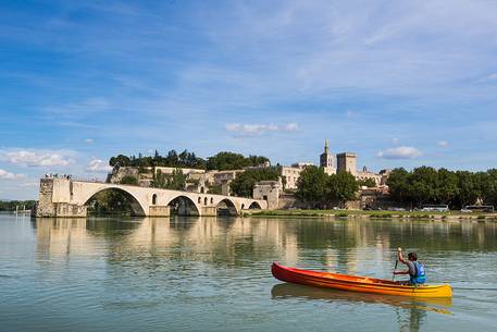 The city of Avignon across the Rhone River. The historic bridge of Avignon, Pont Saint-Benezet.