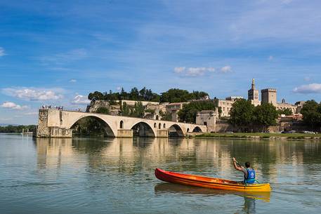 The city of Avignon across the Rhone River. The historic bridge of Avignon, Pont Saint-Benezet.