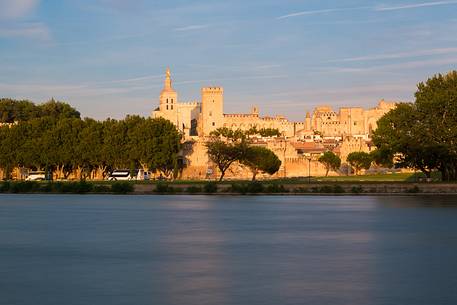 The city of Avignon across the Rhone River. The historic bridge of Avignon, Pont Saint-Benezet.