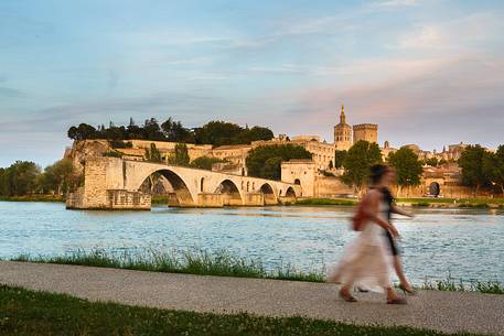 The city of Avignon across the Rhone River. The historic bridge of Avignon, Pont Saint-Benezet.