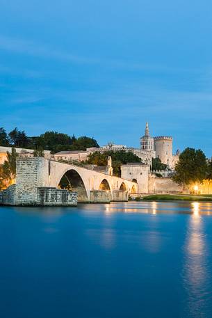 The city of Avignon across the Rhone River. The historic bridge of Avignon, Pont Saint-Benezet.