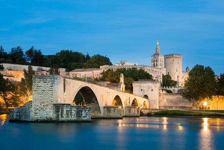 The city of Avignon across the Rhone River. The historic bridge of Avignon, Pont Saint-Benezet.