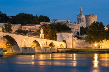 The city of Avignon across the Rhone River. The historic bridge of Avignon, Pont Saint-Benezet.