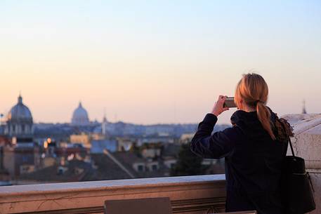 Girl photographing the view of Rome
