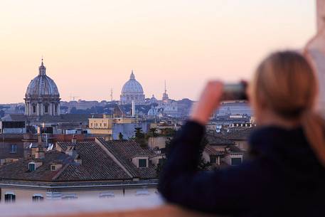 Girl photographing the view of Rome
