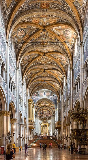 Aisles and frescoes inside the Cathedral of Parma, Italy