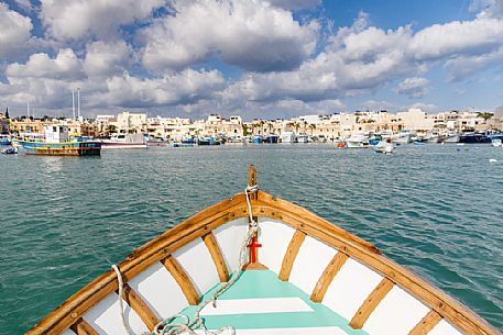 The historic city of Marsaxlokk on the island of Malta from Iuzzu, the typical colorful fishing boats.