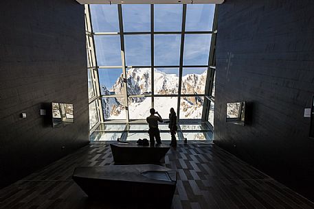 Tourists inside the cableway station of Punta Helbronner taking a picture of Monte Bianco peak, Skyway Mont Blanc, Courmayeur, Aosta Valley, Italy, Europe