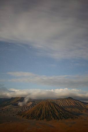 Starry night and smoking volcano, Bromo Tengger Semeru National Park, Isle of Java.