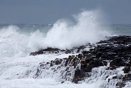 Stormy sea and basaltic rocks at Giant's Causeway, Northern Ireland