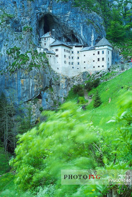 Predjama Castle emerging from its cave