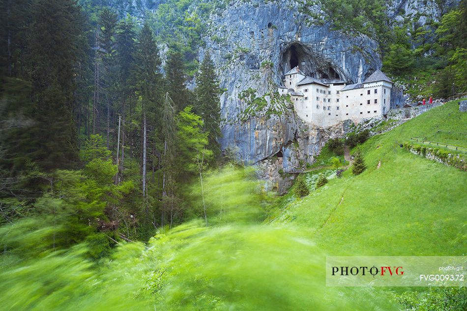 Predjama Castle emerging from its cave