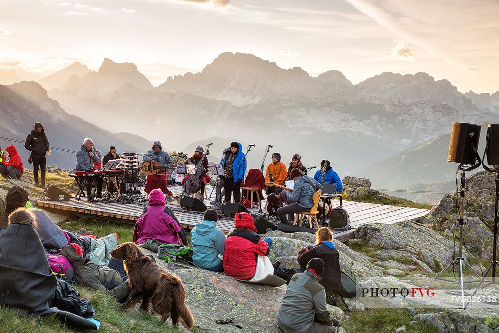 Sounds of the Dolomites, the high altitude music festival in Trentino.  At Sunrise many people listen to a concert on Col Margherita, dolomites, Italy