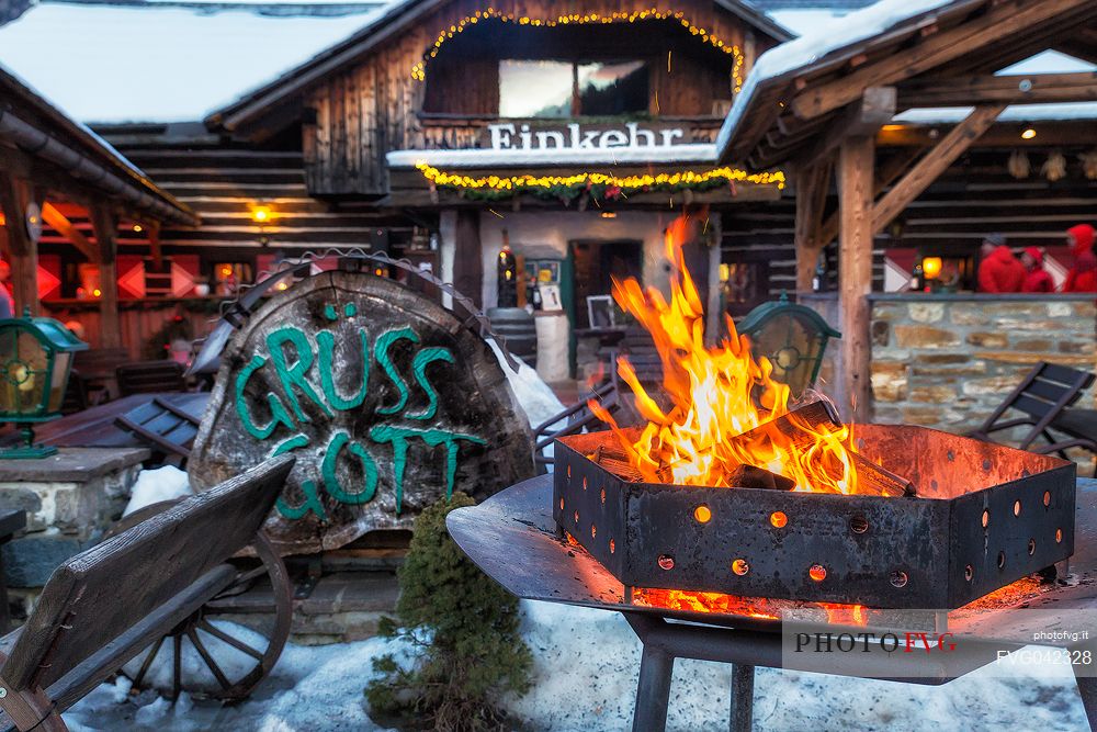 Welcome fire in the entrance of Einkehr restaurant, a famous typical restaurant in  Bad Kleinkirchheim, Carinthia, Austria, Europe