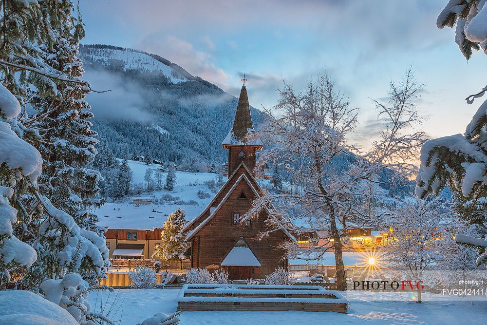 Winter view of the Evangelican church in Bad Kleinkirchheim at twilight, Carinthia, Austria, Europe