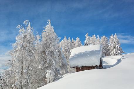 Cottage under snow in Sanctuary Mont Lussari