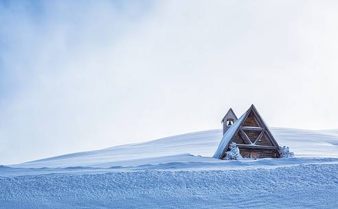 Chapel of Passo Giau under the snow