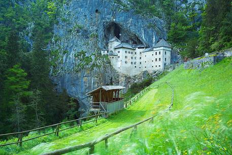 Predjama Castle emerging from its cave