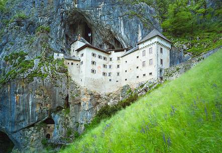 Predjama Castle emerging from its cave