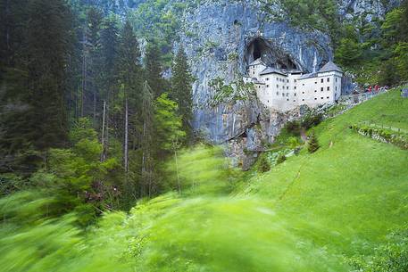 Predjama Castle emerging from its cave