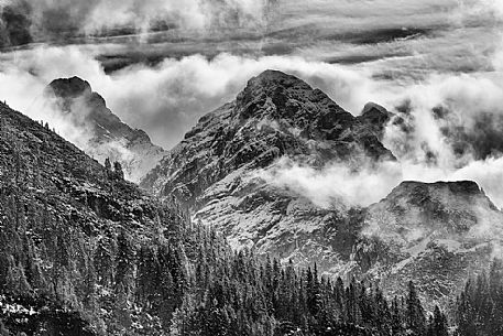 Dolomiti of Brenta,Natural Park of Adamello-Brenta, mountains through the fog Dolomiti of Brenta,Natural Park of Adamello-Brenta, mountains through the fog