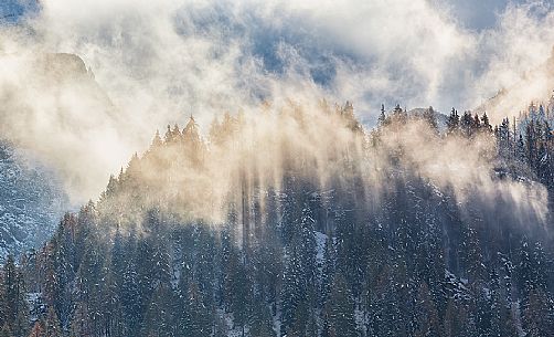 Dolomiti of Brenta,Natural Park of Adamello-Brenta, mountains through the fog Dolomiti of Brenta,Natural Park of Adamello-Brenta, mountains through the fog