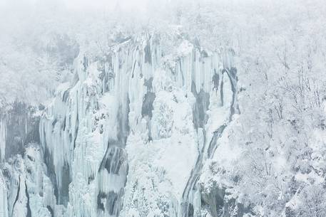 Frozen lakes and waterfalls in Plitvice Lakes National Park, Croatia