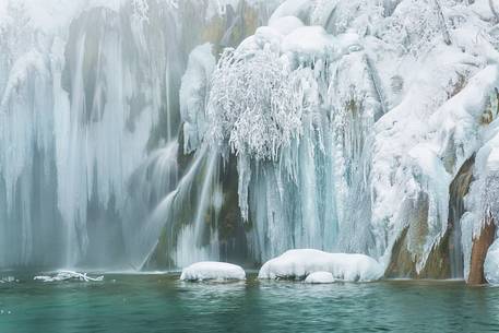 Frozen lakes and waterfalls in Plitvice Lakes National Park, Croatia