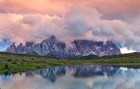 Sunrise at Cavia Lake and in the backgroud the Pale di San Martino dolomites, Passo San Pellegrino, Italy