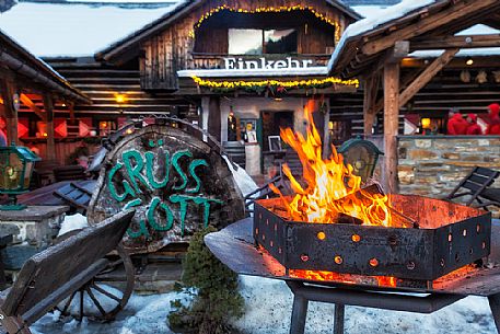 Welcome fire in the entrance of Einkehr restaurant, a famous typical restaurant in  Bad Kleinkirchheim, Carinthia, Austria, Europe