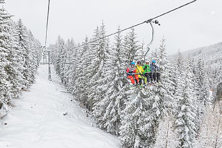 Skiers in the chair lift of Maibrunnbahn, Bad Kleinkirchheimm, Carinthia, Austria, Europe