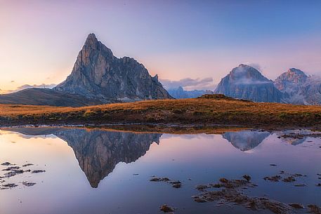 Giau Pass at twilight, Gusela and Tofana mounts reflected on pond, dolomites, Cortina d'Ampezzo, Veneto, Italy, Europe