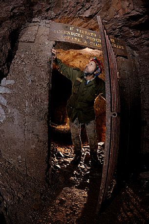 Scout is outing from the explosive room inside the Molinello mine, Val Graveglia valley, Liguria, Italy