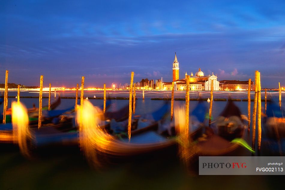 Evening's lights on the gondolas in St. Mark's basin in Venice, in the background the Church of San Giorgio Maggiore, Venice, Italy, Europe