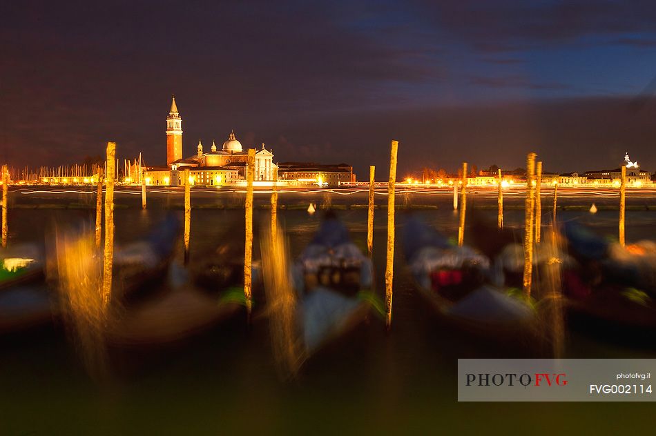 Gondolas in St. Mark's basin in Venice, in the background the Church of San Giorgio Maggiore by night, Venice, Italy, Europe