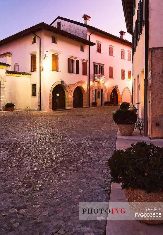 Evening view of street Cesare Battisti in the ancient village of Valvasone, Friuli Venezia Giulia, Italy, Europe