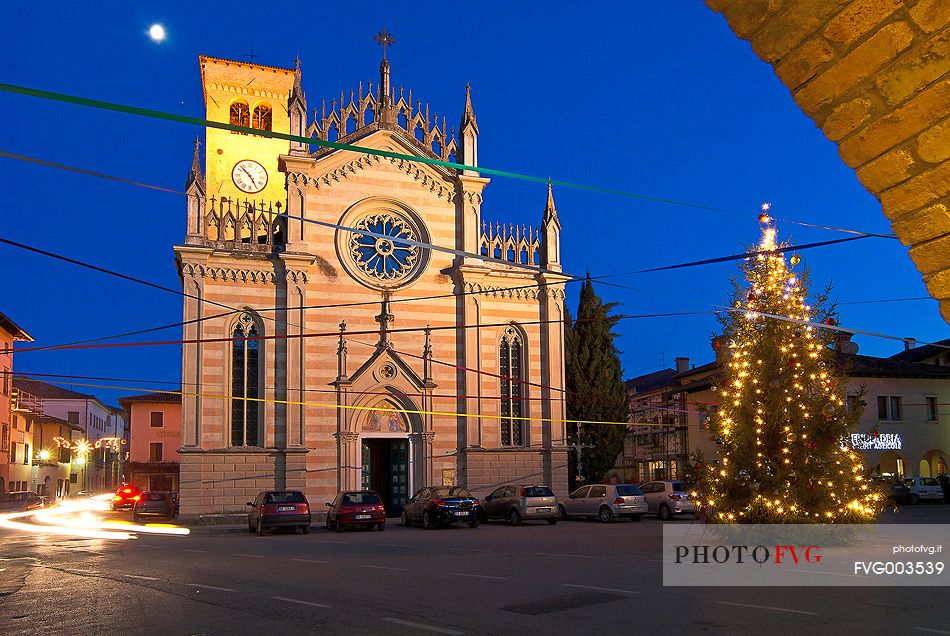 Christmas lights and cathedral in Piazza Libert square in the ancient village of Valvasone. Friuli Venezia Giulia, Italy, Europe