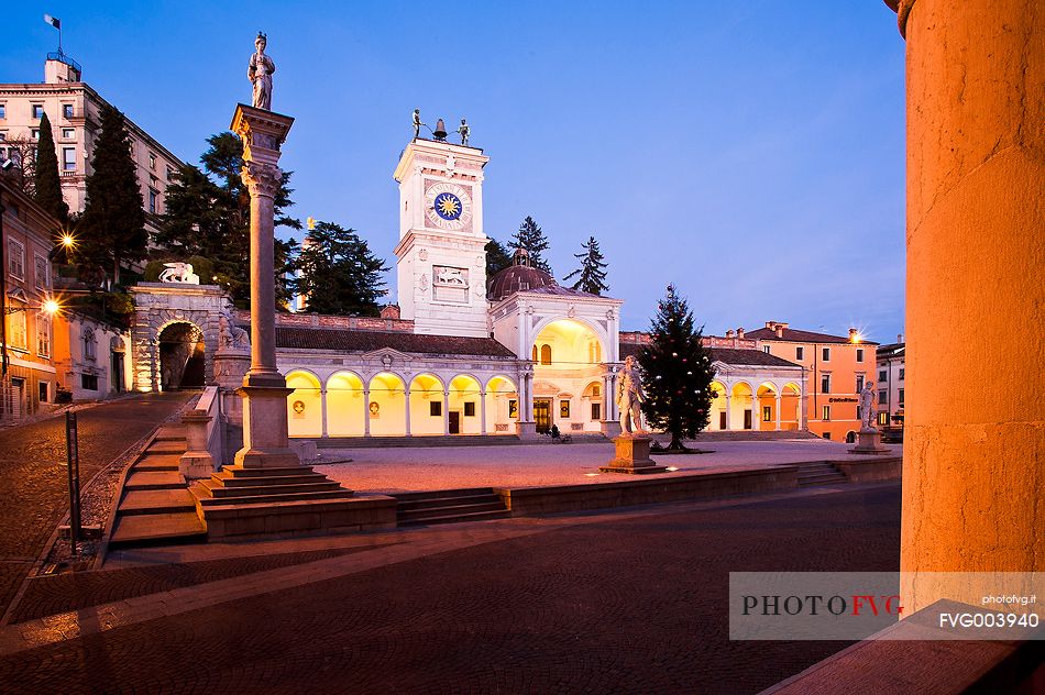 Loggia di San Giovanni, the Renaissance portico surmounted by a clock tower and the column of san Marco in Piazza della Libert, in the background the castle, Udine, Friuli Venezia Giulia, Italy, Europe 