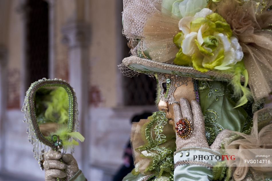 Carnival mask is mirroring in Venice, Italy