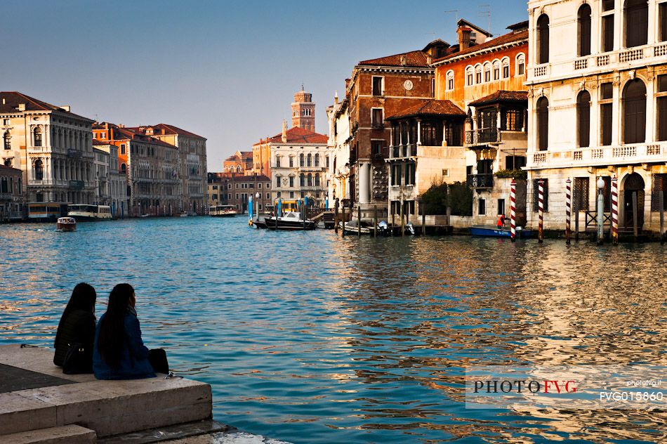 Tourists watching the Grand Canal or Canal Grande near the Accademia Bridge in Venice, Italy, Europe