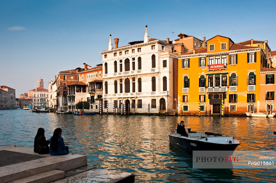 Tourists watching the Grand Canal or Canal Grande near the Accademia Bridge in Venice, Italy, Europe