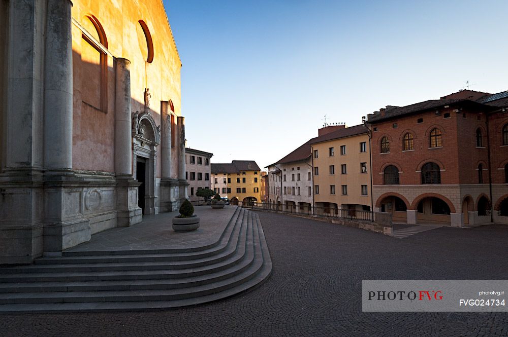 The sun illuminates the ancient Cathedral of Saint Mark in Pordenone, Friuli Venezia Giulia, Italy, Europe