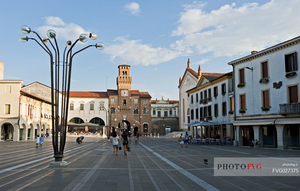 Great Square in Oderzo village. In the background the Trevisana Door or The clock Tower, symbol of the city, Veneto, Italy.