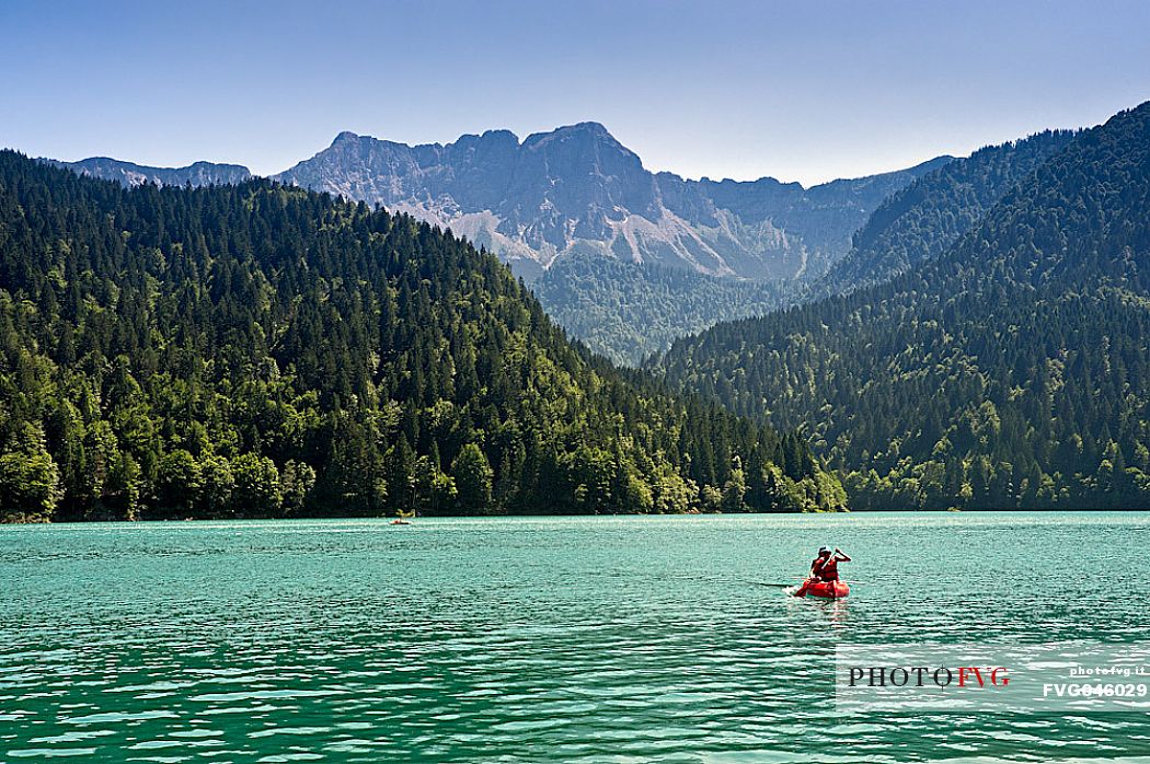 Canoe tourists on Lake Sauris, Carnic Alps, Friuli Venezia Giulia, Italy, Europe