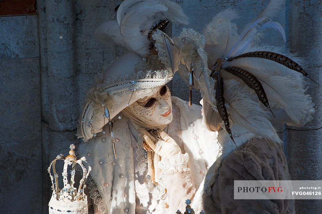 A pair of carnival masks under the loggia of the Doge's palace in Venice.Italy