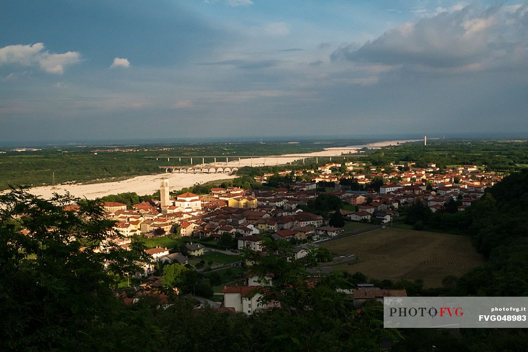 Montereale Valcellina, in the province of Pordenone, is one of the most important places of historical and archaeological interest in Friuli Venezia Giulia and stage of the journey of St. Christopher. In the background, the bed of the Cellina river and the Ponte Giulio. Italy

