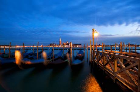 Evening's lights on the gondolas in St. Mark's basin in Venice, in the background the Church of San Giorgio Maggiore, Venice, Italy, Europe Evening's lights on the gondolas in St. Mark's basin in Venice, in the background the Church of San Giorgio Maggiore, Venice, Italy, Europe
