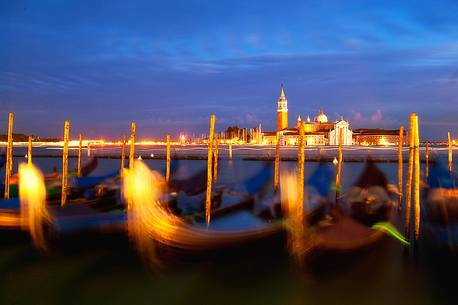 Evening's lights on the gondolas in St. Mark's basin in Venice, in the background the Church of San Giorgio Maggiore, Venice, Italy, Europe